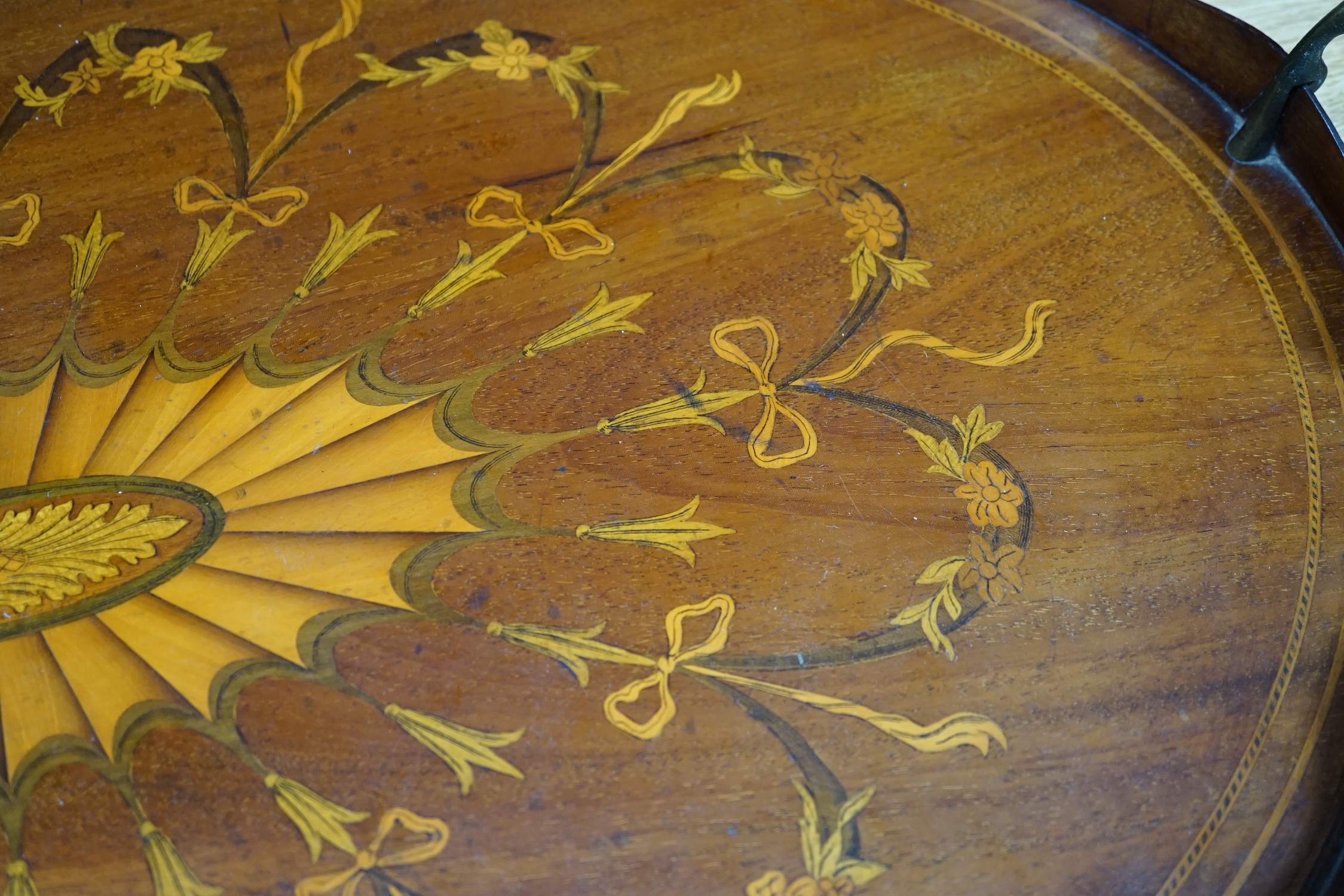 An Edwardian marquetry inlaid oval mahogany two handled tea tray, 63cm